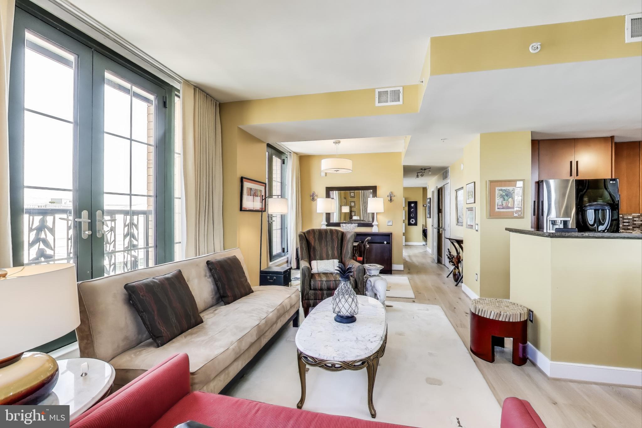 910 M Street Northwest, Unit 1022 Washington, DC 20001 - Photo 6 of 64 a living room with furniture and a large window