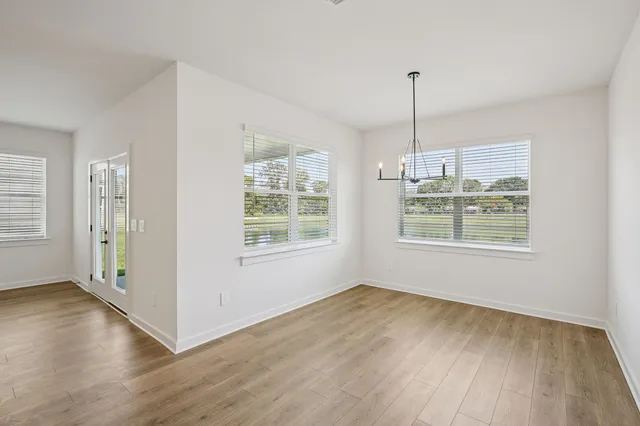 an open kitchen with a sink and dish washer
