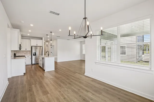 a view of kitchen with wooden floor