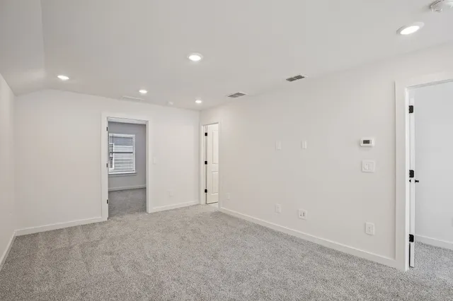 a bathroom with double vanity sinks and a mirror