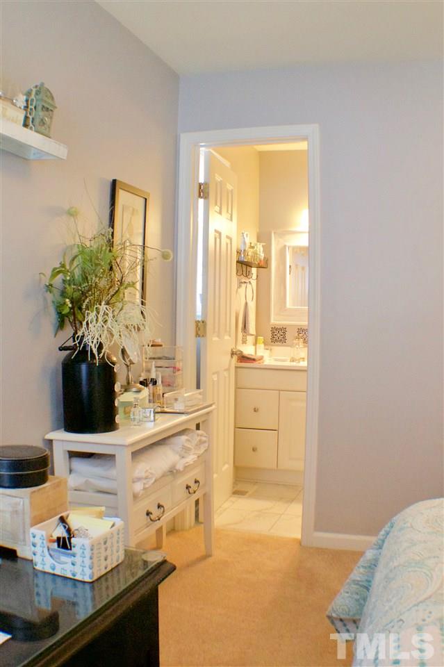 4436 Archibald Way Raleigh, NC 27616 - Photo 19 of 25 a room with sink and mirror