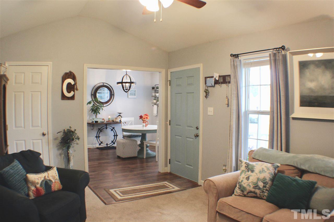 4436 Archibald Way Raleigh, NC 27616 - Photo 5 of 25 a living room with furniture and a window