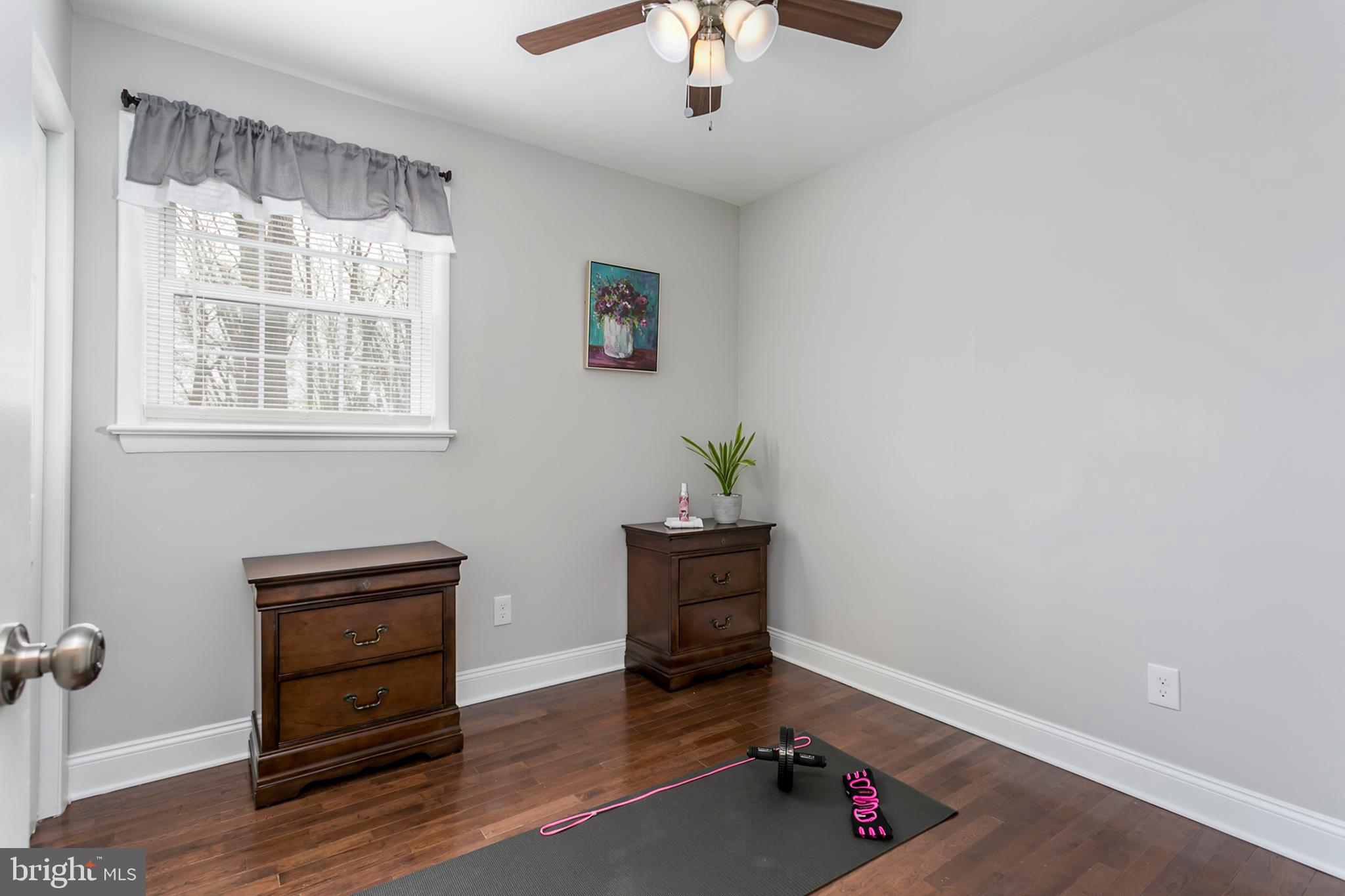 21131 Ridge Road Freeland, MD 21053 - Photo 14 of 33 an empty room with wooden floor and windows