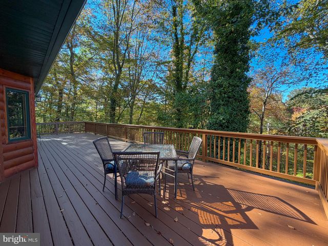 a small barn with a table and a chairs
