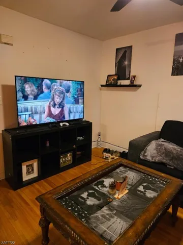 a room with furniture and flat screen tv