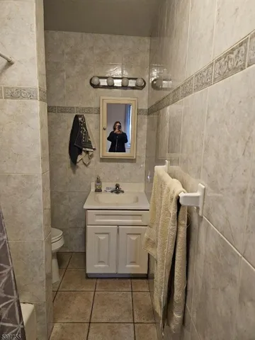 a bathroom with a shower and a glass door
