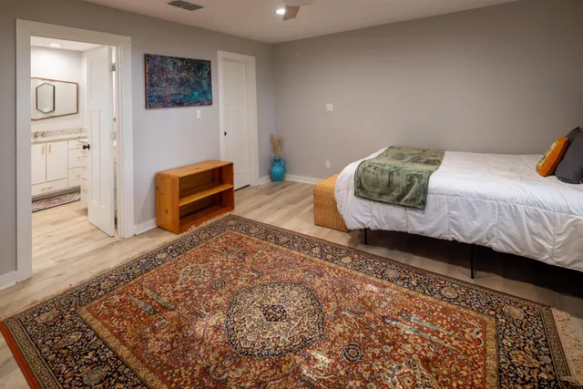 a bedroom with a bed and a dresser