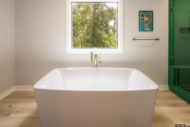 a white bath tub sitting in a bathroom