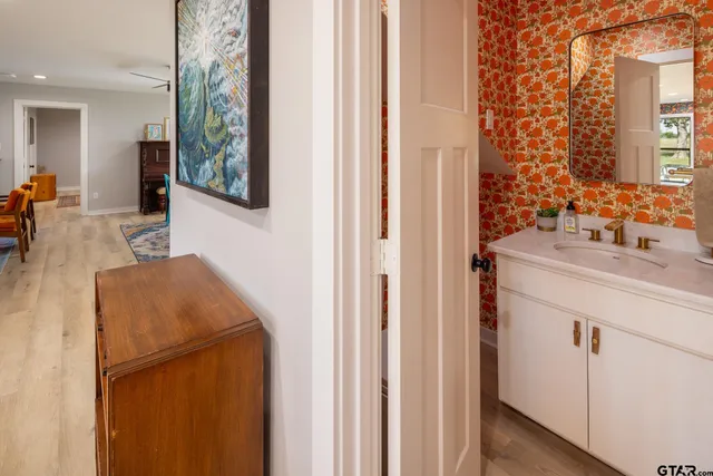 a bathroom with a tub and a window
