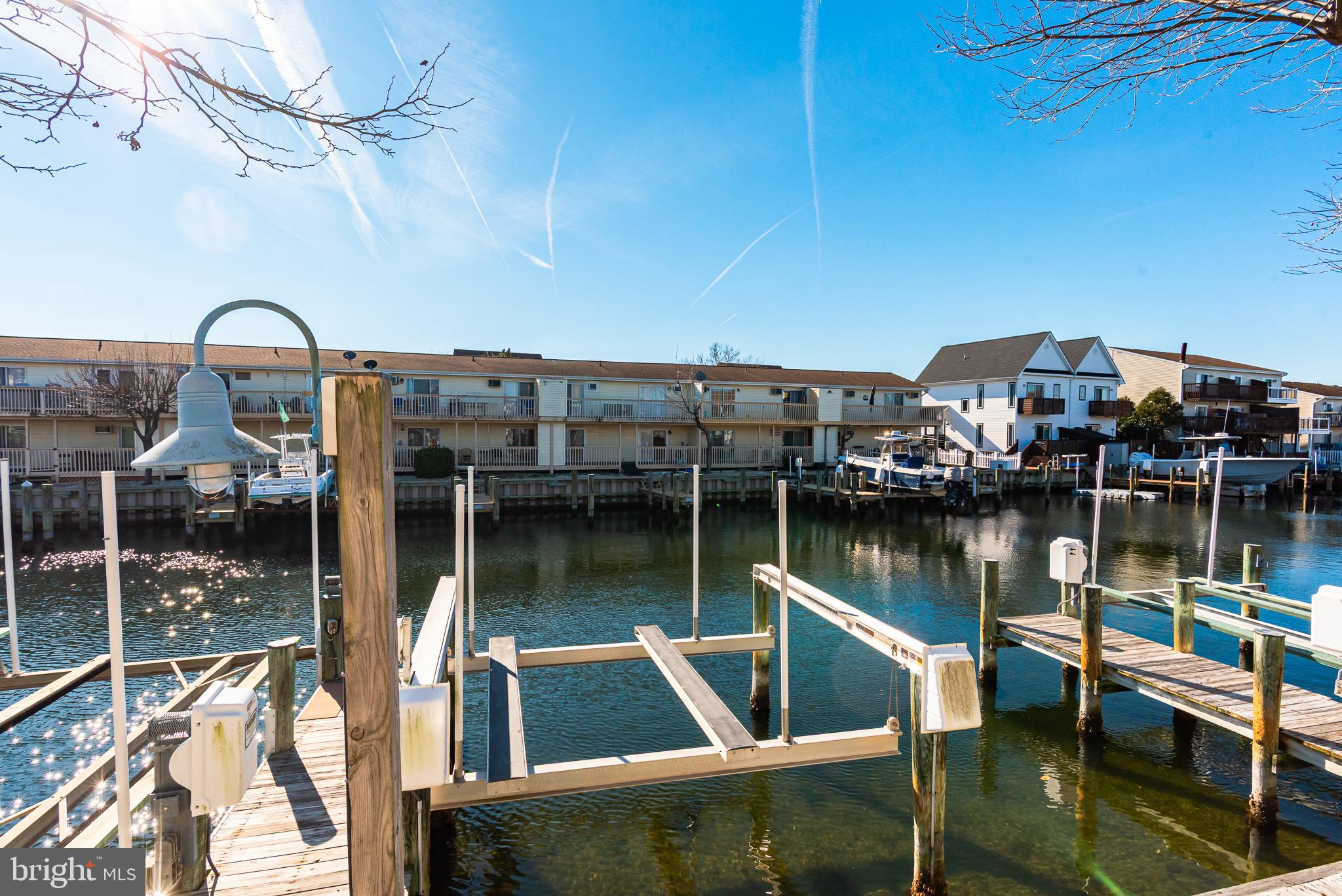 131 Newport Bay Drive, Unit 2 Ocean City, MD 21842 - Photo 11 of 61 a view of a lake from a balcony