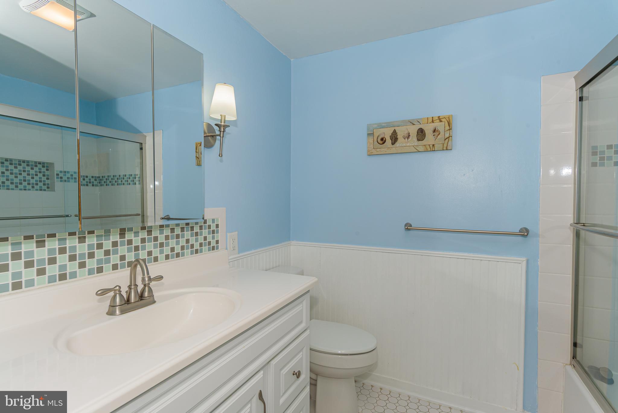 131 Newport Bay Drive, Unit 2 Ocean City, MD 21842 - Photo 33 of 61 a bathroom with a sink toilet and shower