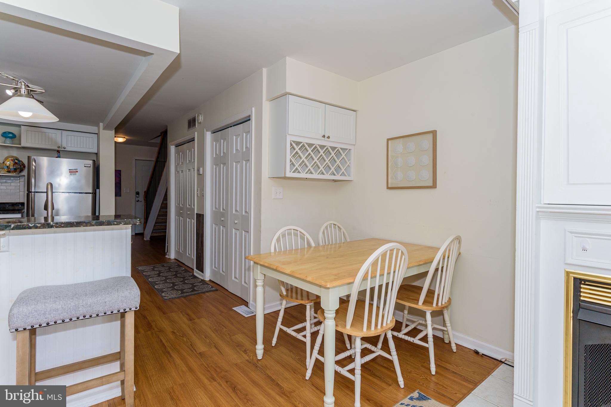 131 Newport Bay Drive, Unit 2 Ocean City, MD 21842 - Photo 51 of 61 a view of a dining room with furniture and wooden floor