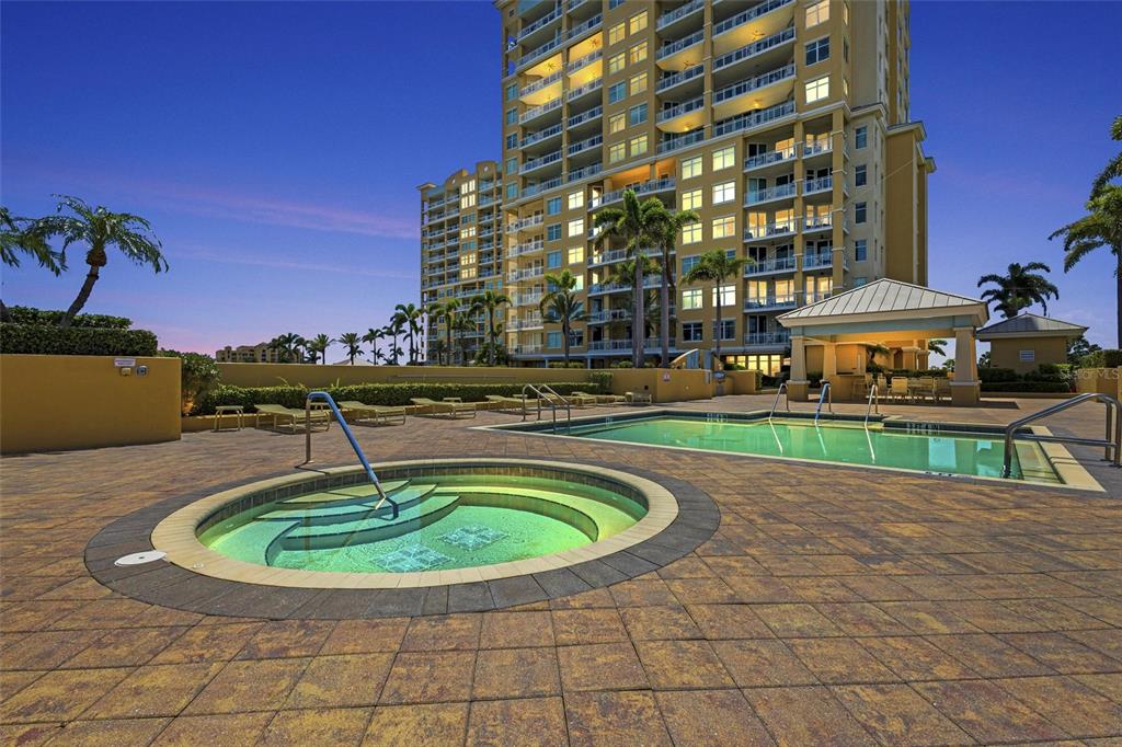 140 Riviera Dunes Way, Unit 206 Palmetto, FL 34221 - Photo 29 of 46 a swimming pool with outdoor seating
