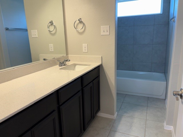5601 Corso Court Austin, TX 78747 - Photo 13 of 18 a bathroom with a sink and a mirror