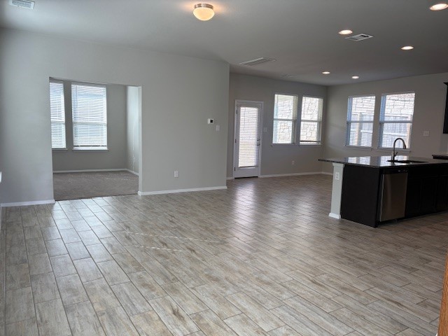 5601 Corso Court Austin, TX 78747 - Photo 18 of 18 a view of a livingroom with furniture wooden floor and windows