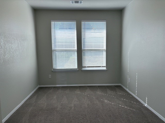 5601 Corso Court Austin, TX 78747 - Photo 5 of 18 an empty room with a window
