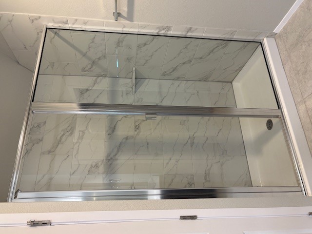 5601 Corso Court Austin, TX 78747 - Photo 8 of 18 a bathroom with a shower