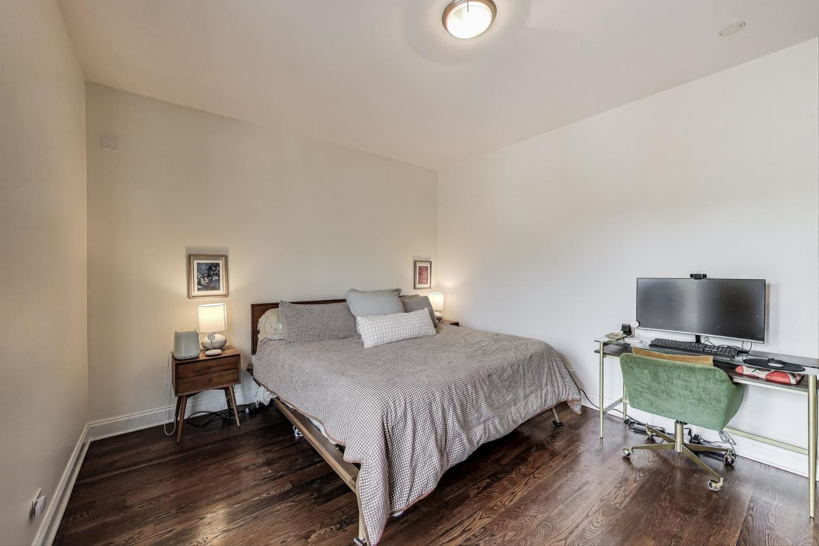 2120 West Rice Street, Unit 3 Chicago, IL 60622 - Photo 14 of 28 a bedroom with a bed and a flat screen tv