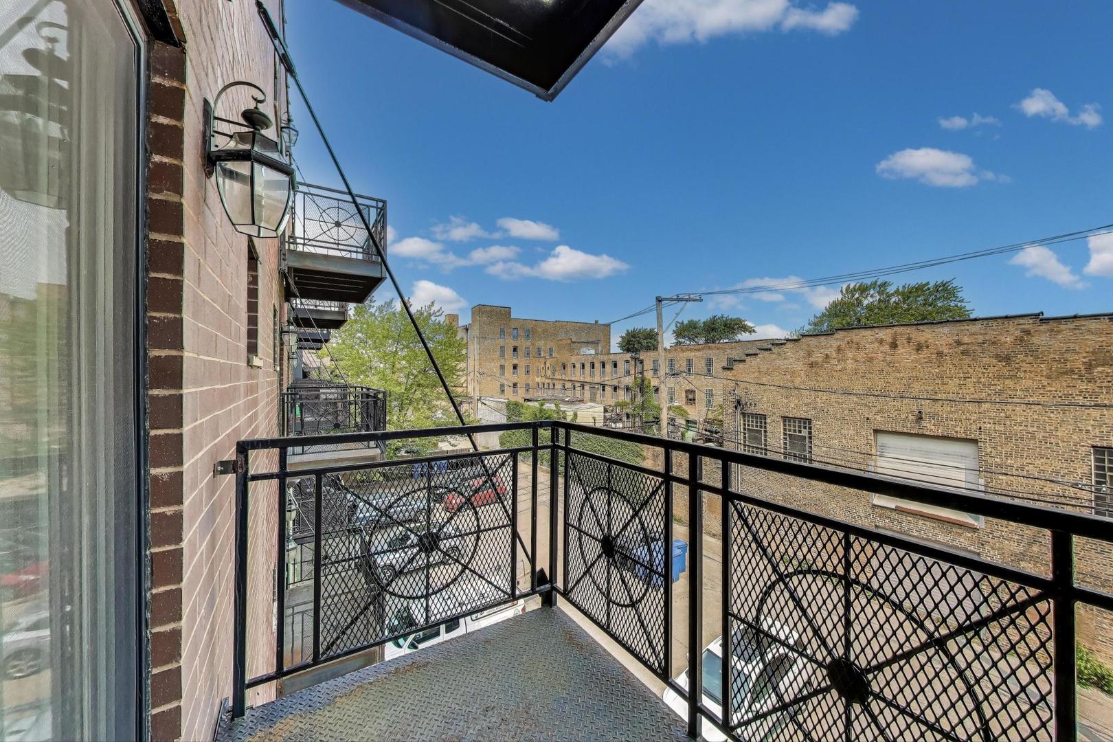 2120 West Rice Street, Unit 3 Chicago, IL 60622 - Photo 19 of 28 a view of balcony with lots of frames on wall