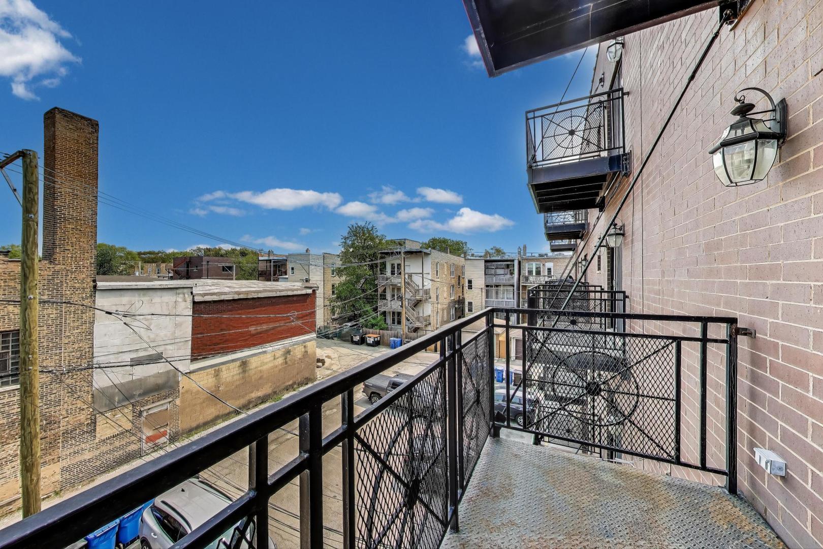 2120 West Rice Street, Unit 3 Chicago, IL 60622 - Photo 20 of 28 a view of a balcony with an outdoor space