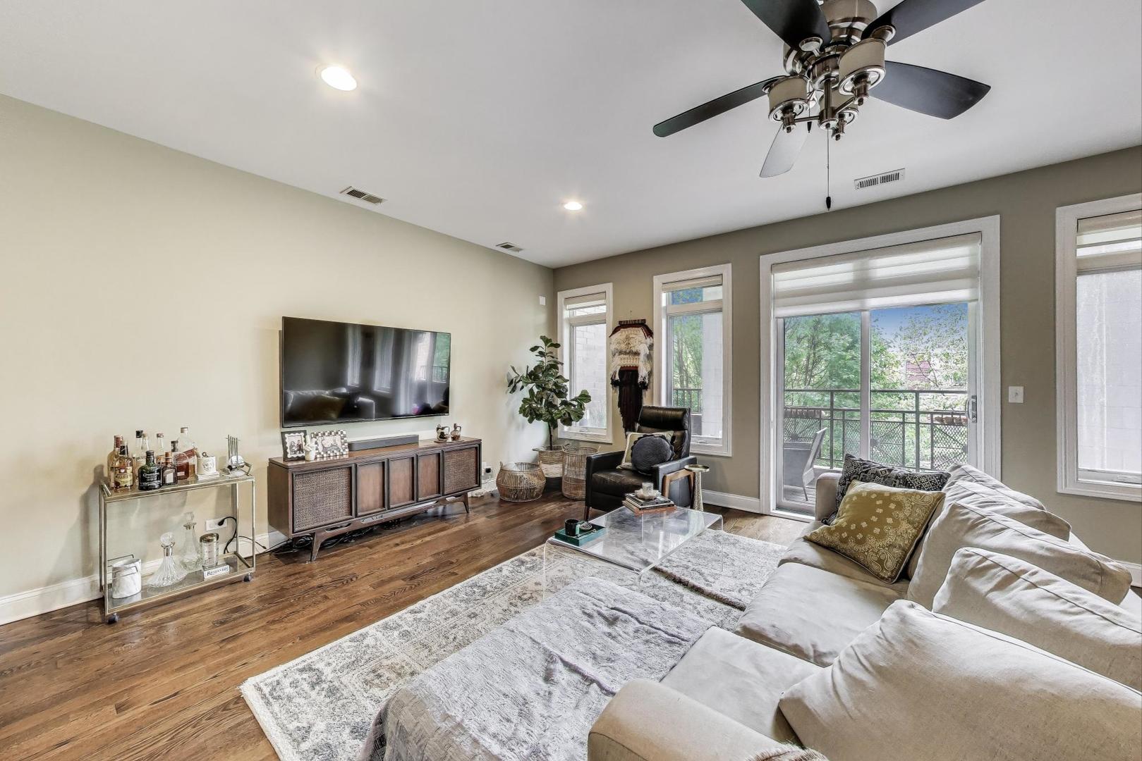 2120 West Rice Street, Unit 3 Chicago, IL 60622 - Photo 2 of 28 a living room with furniture and a flat screen tv