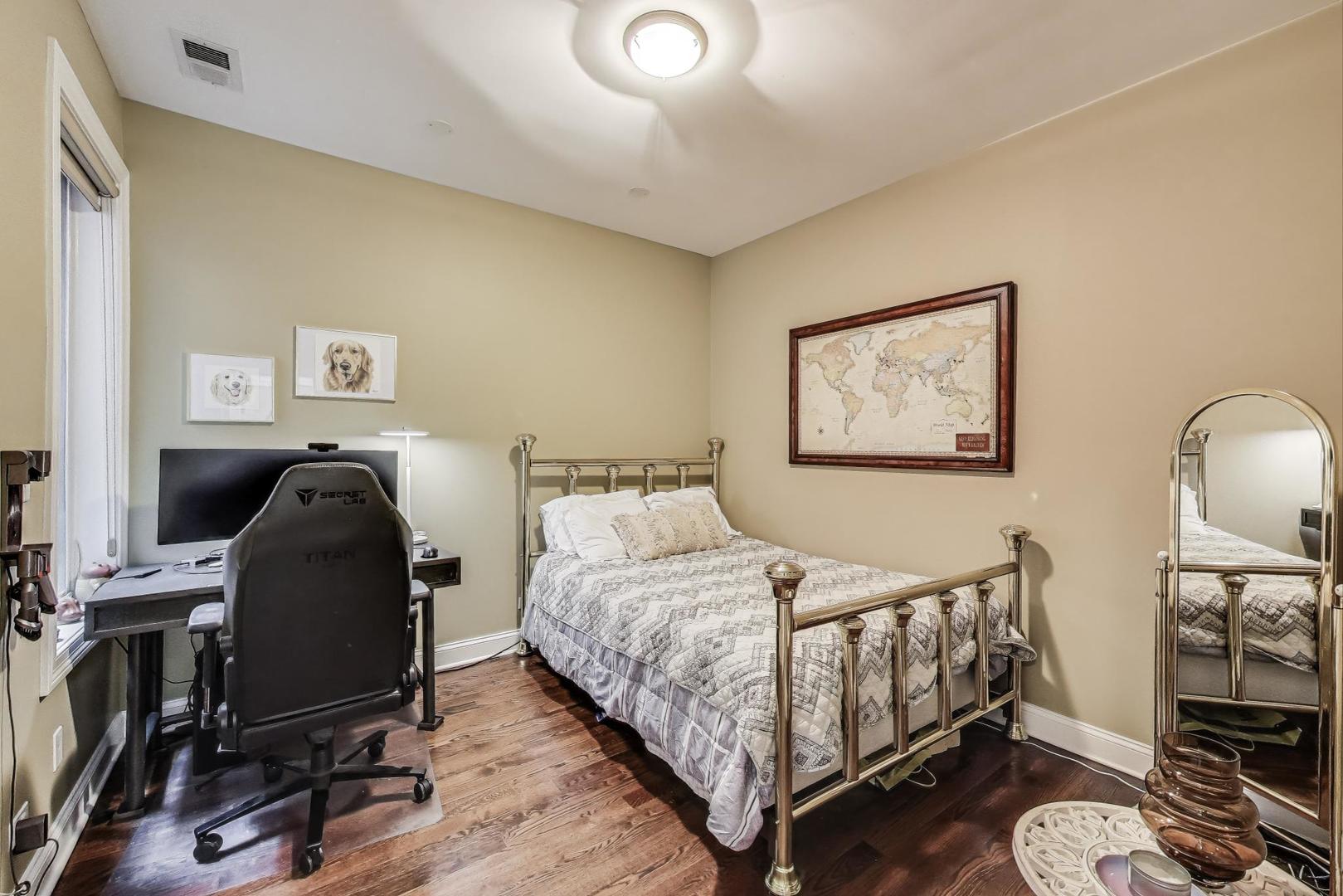 2120 West Rice Street, Unit 3 Chicago, IL 60622 - Photo 21 of 28 a bedroom with a bed and wooden floor