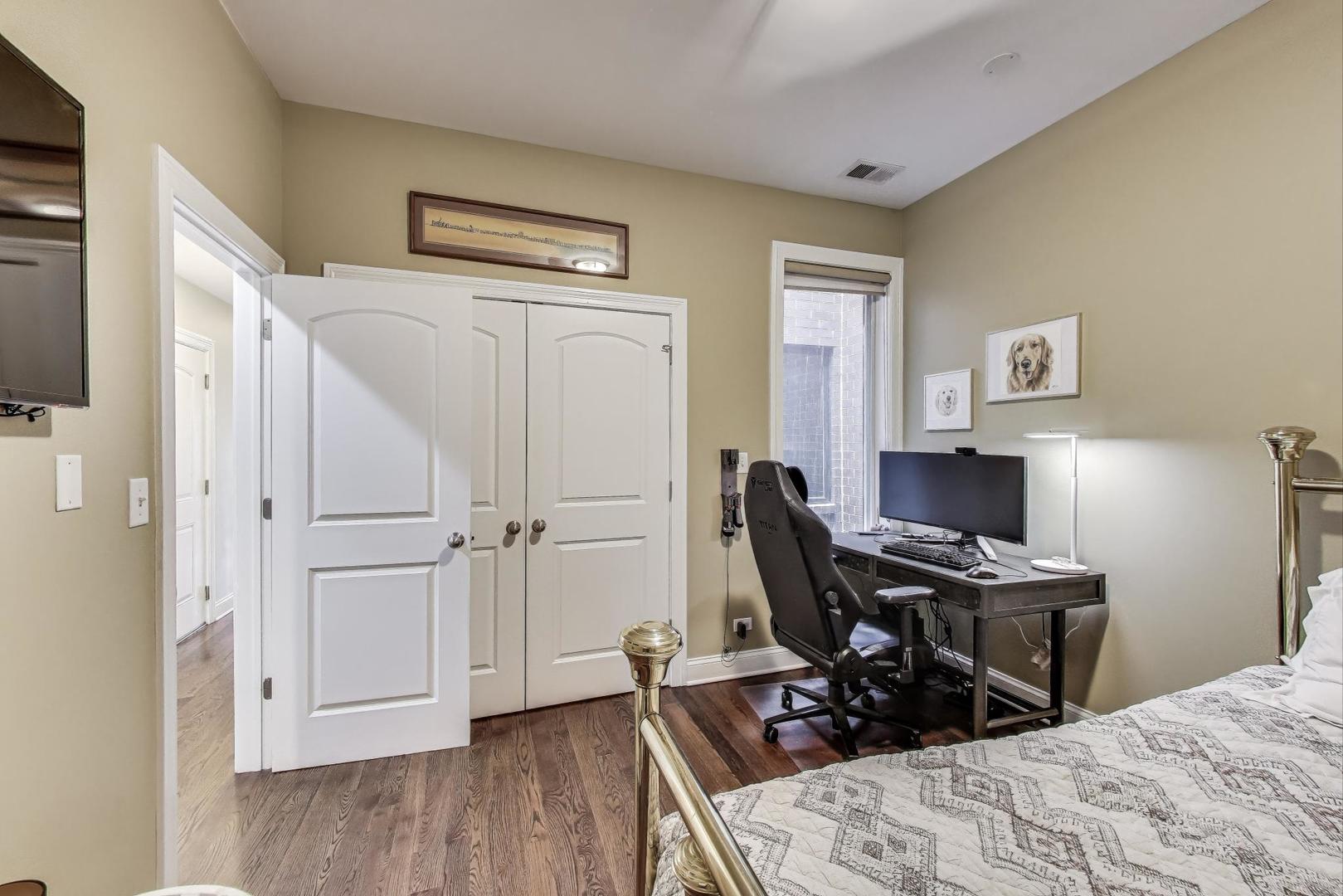 2120 West Rice Street, Unit 3 Chicago, IL 60622 - Photo 22 of 28 a bedroom with a bed and a workspace