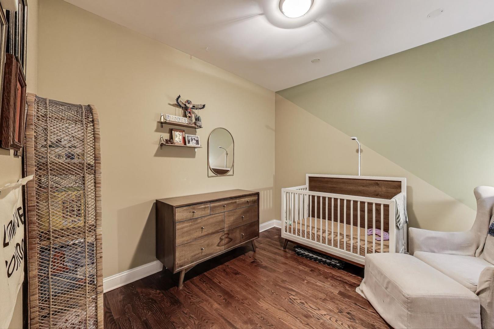 2120 West Rice Street, Unit 3 Chicago, IL 60622 - Photo 23 of 28 a bedroom with furniture and a window