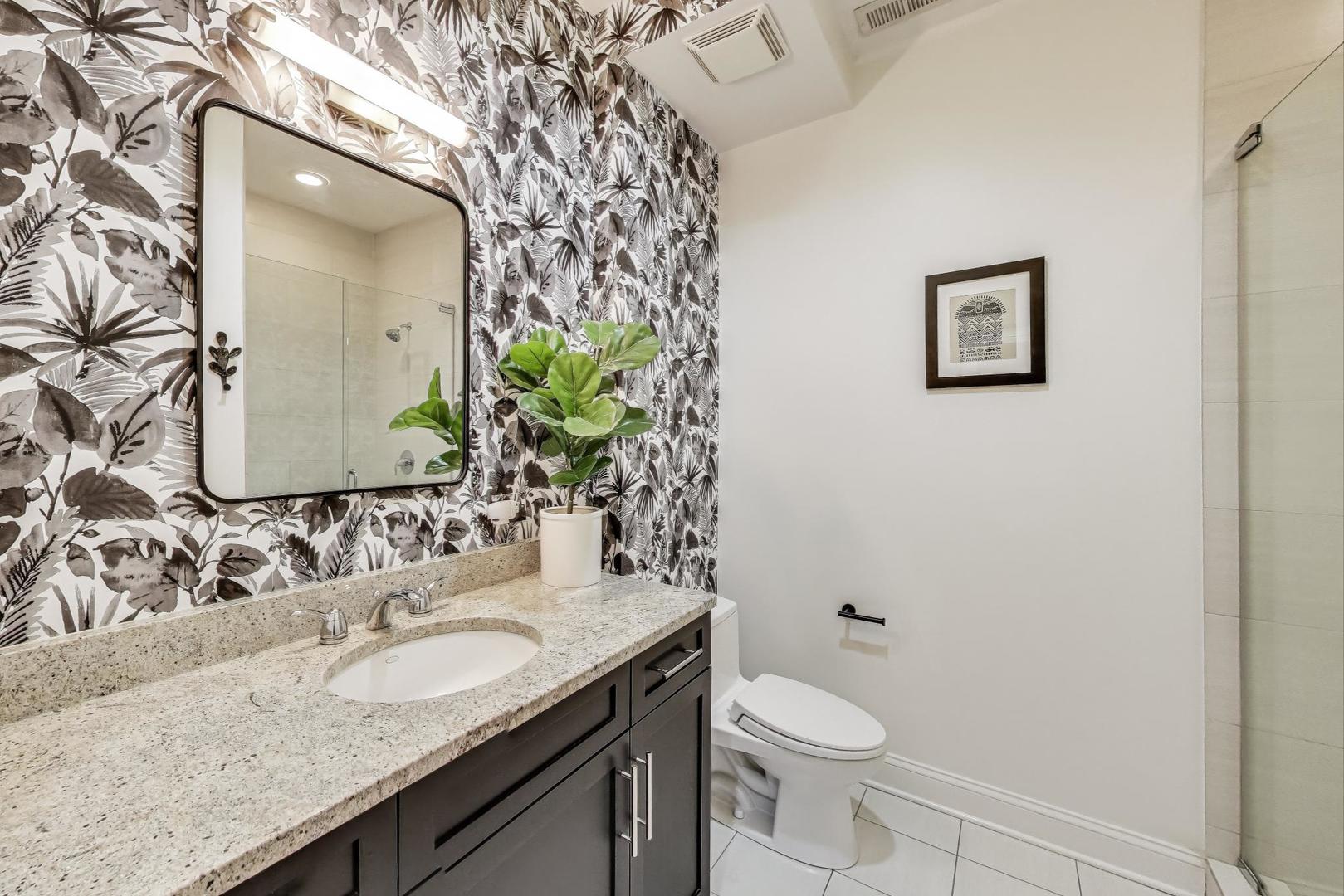 2120 West Rice Street, Unit 3 Chicago, IL 60622 - Photo 25 of 28 a bathroom with a granite countertop sink and a mirror