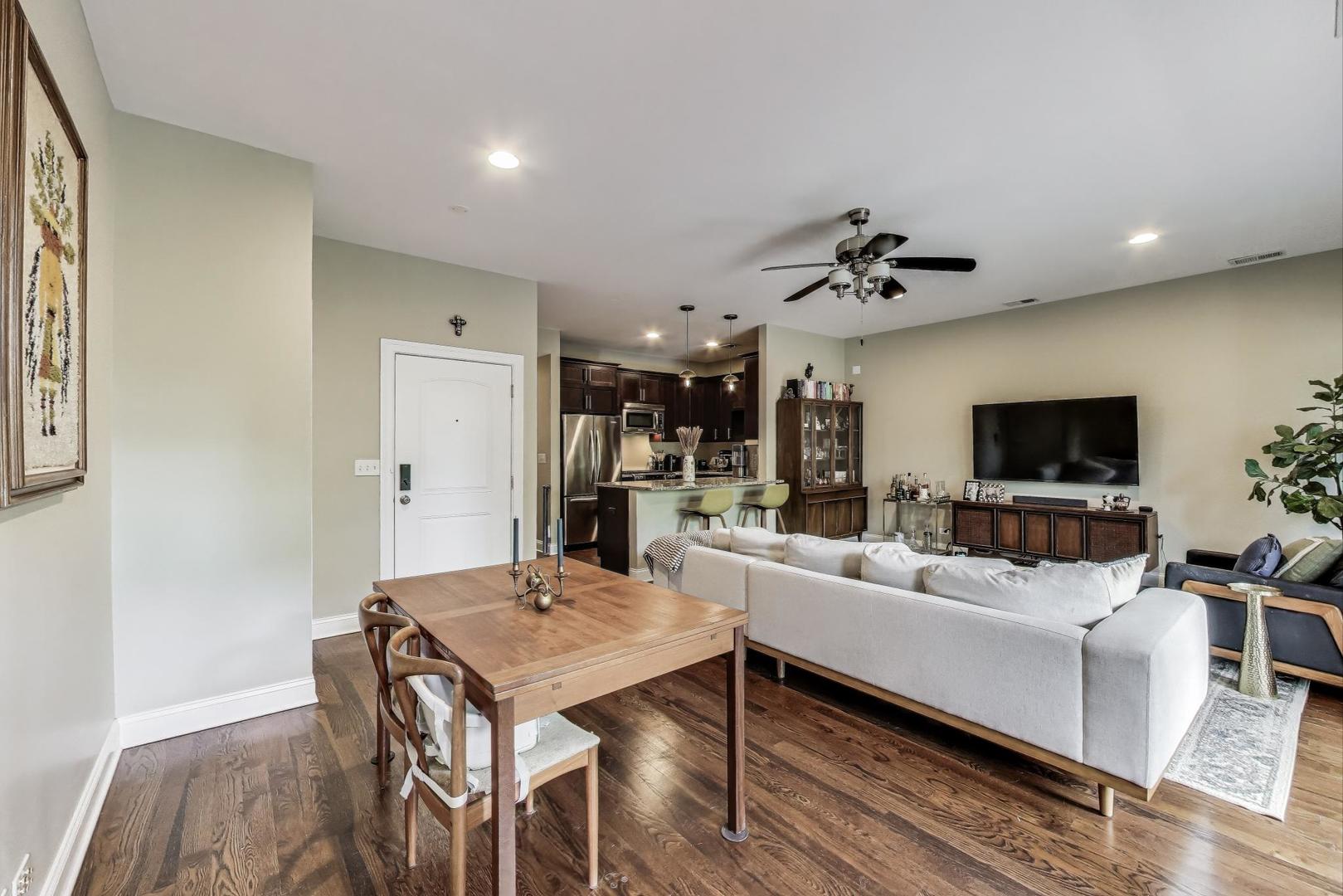 2120 West Rice Street, Unit 3 Chicago, IL 60622 - Photo 7 of 28 a living room with furniture and a flat screen tv
