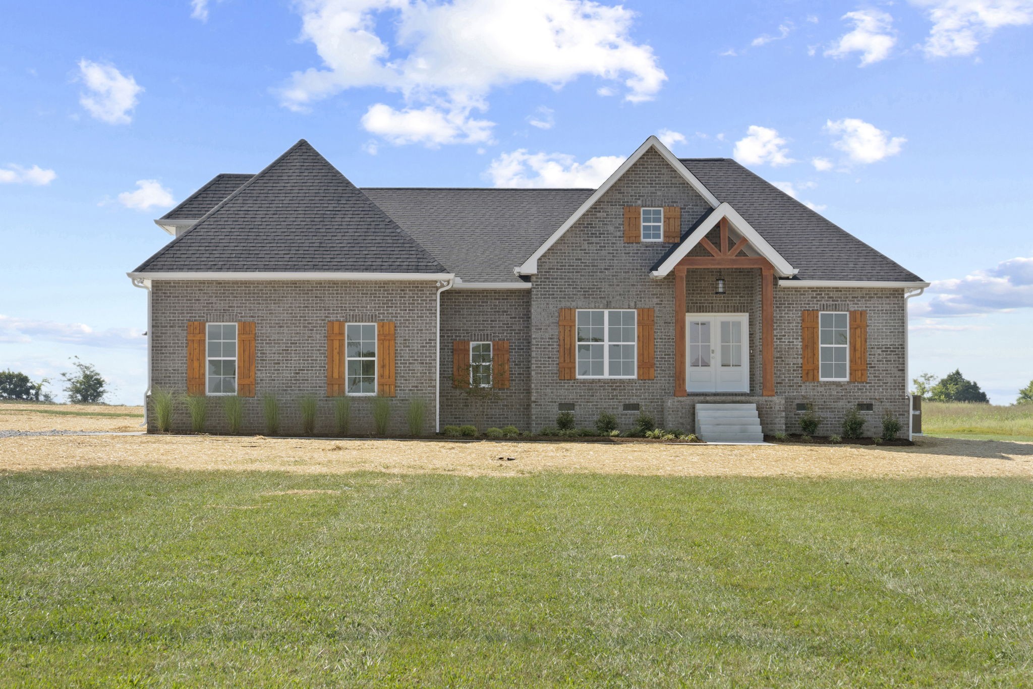 a front view of a house with a yard