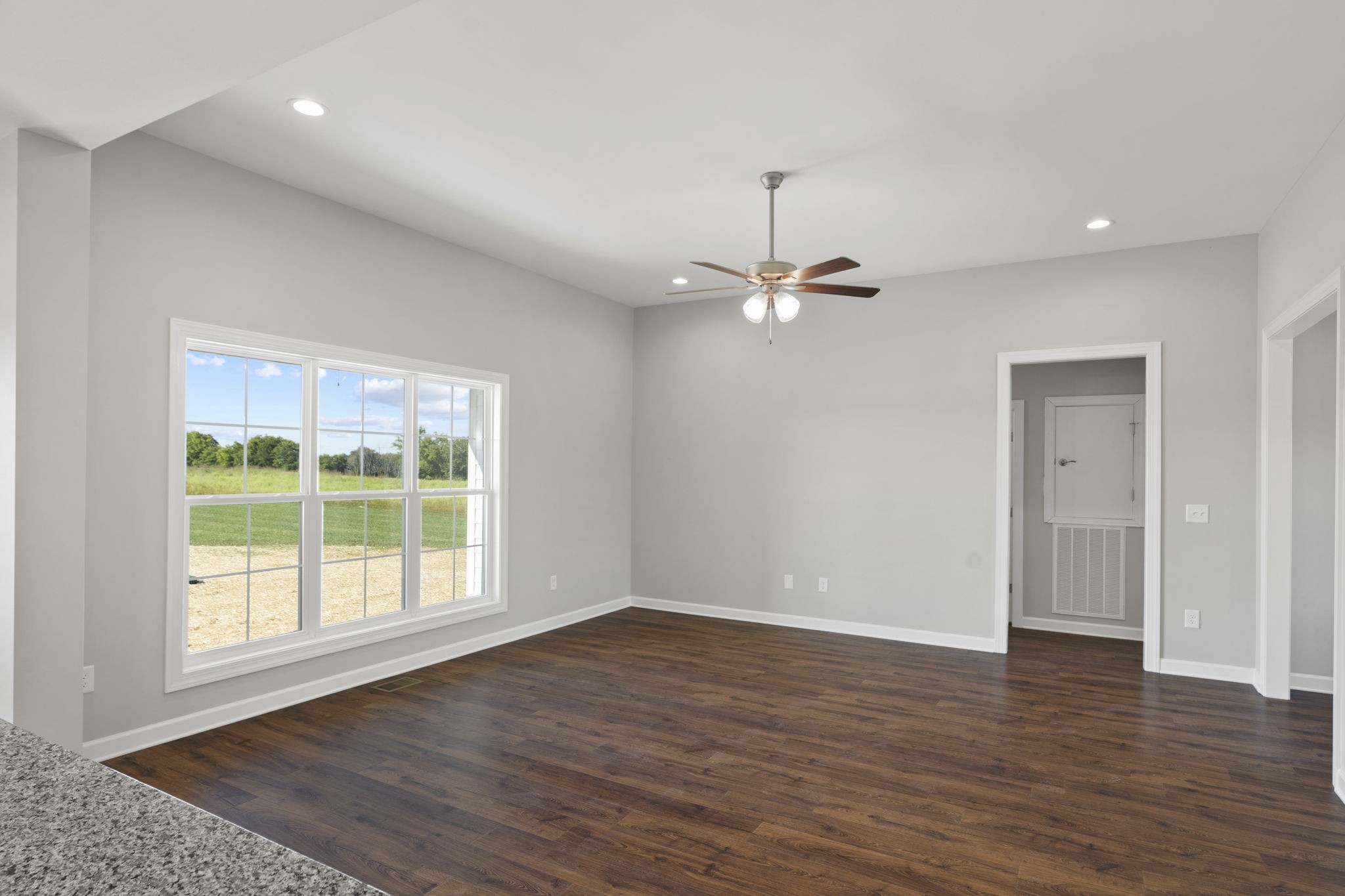 5557 Borthick Road Springfield, TN 37172 - Photo 13 of 48 an empty room with wooden floor chandelier and windows