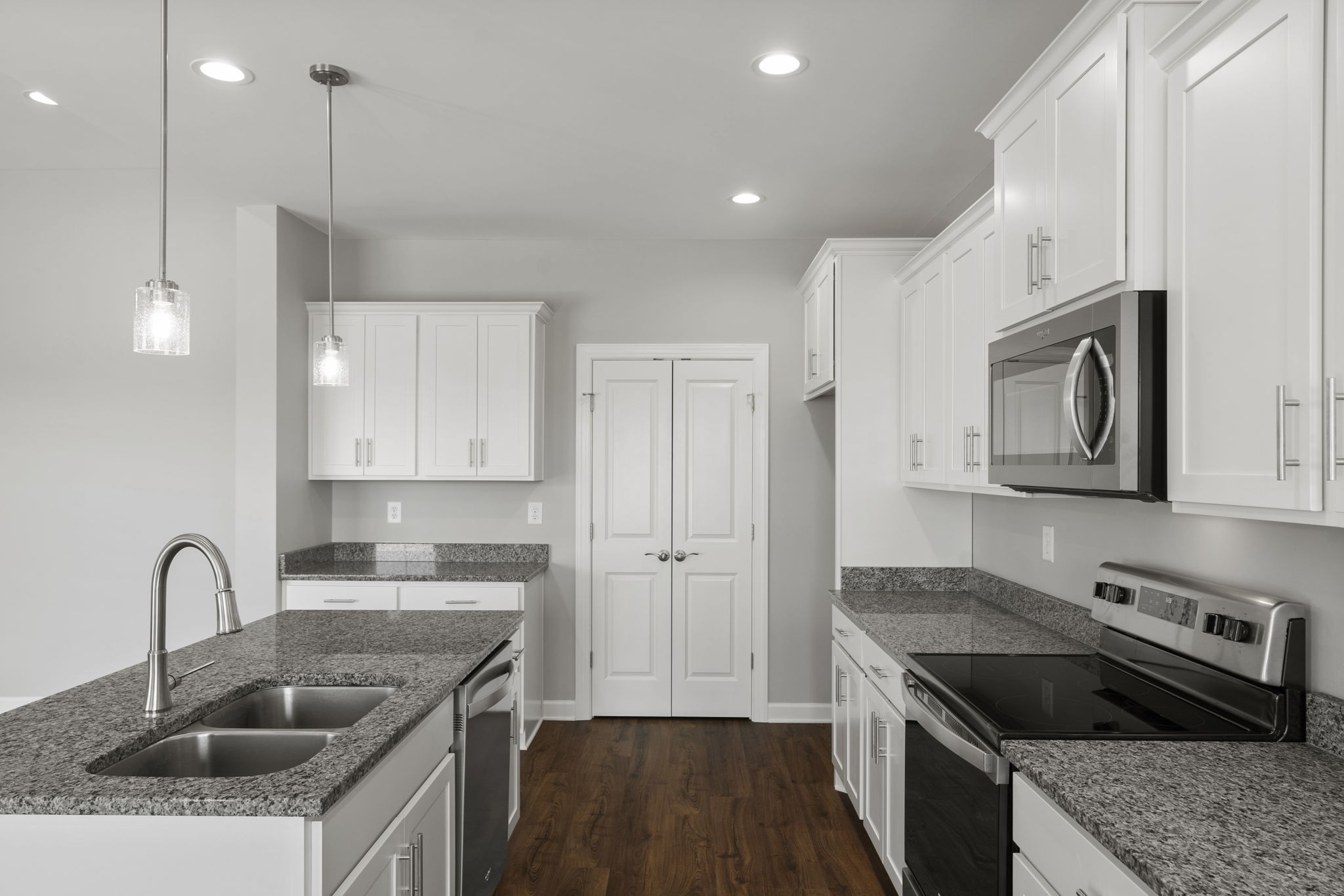 5557 Borthick Road Springfield, TN 37172 - Photo 19 of 48 a kitchen with stainless steel appliances granite countertop a sink stove and refrigerator