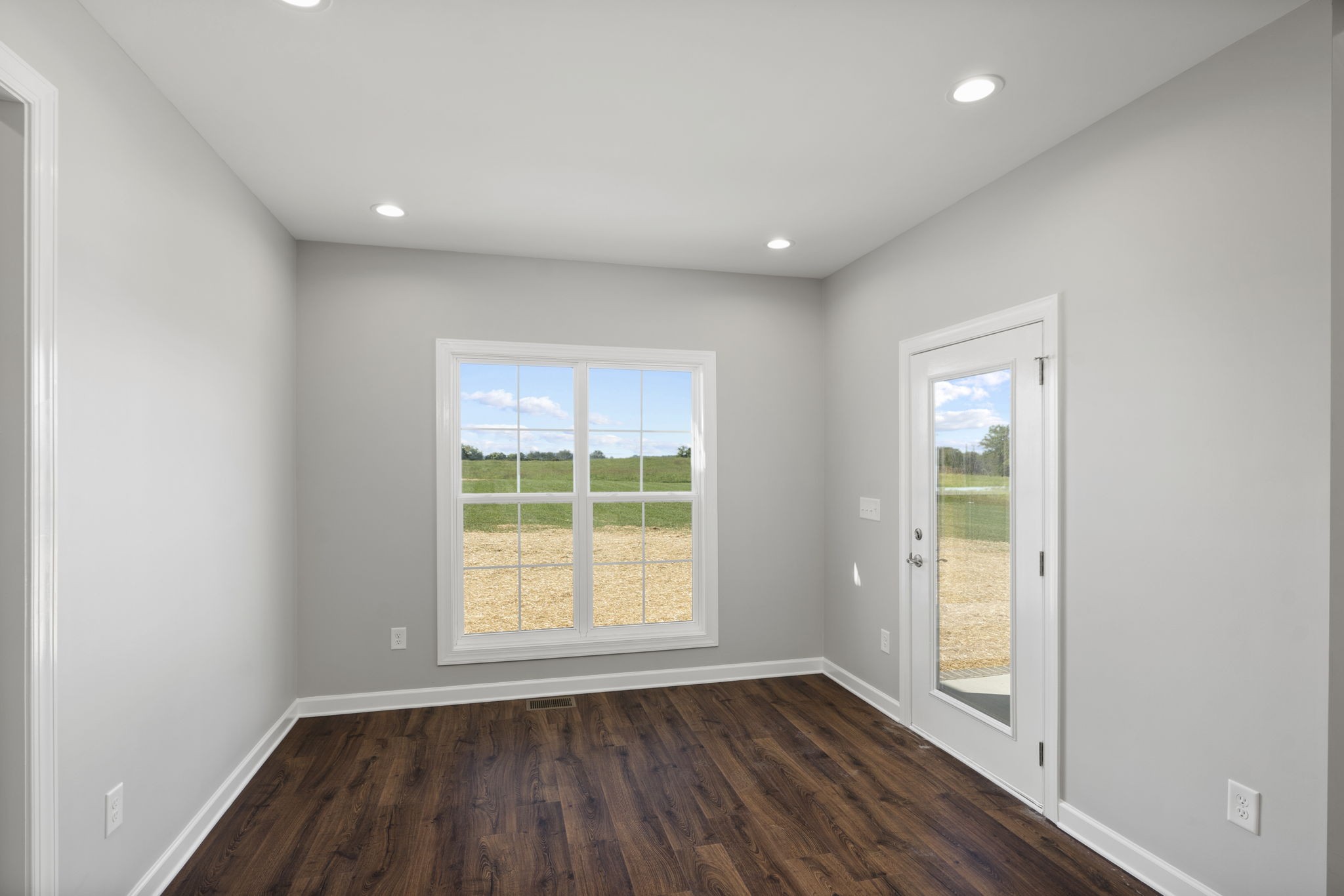 5557 Borthick Road Springfield, TN 37172 - Photo 21 of 48 an empty room with wooden floor and windows