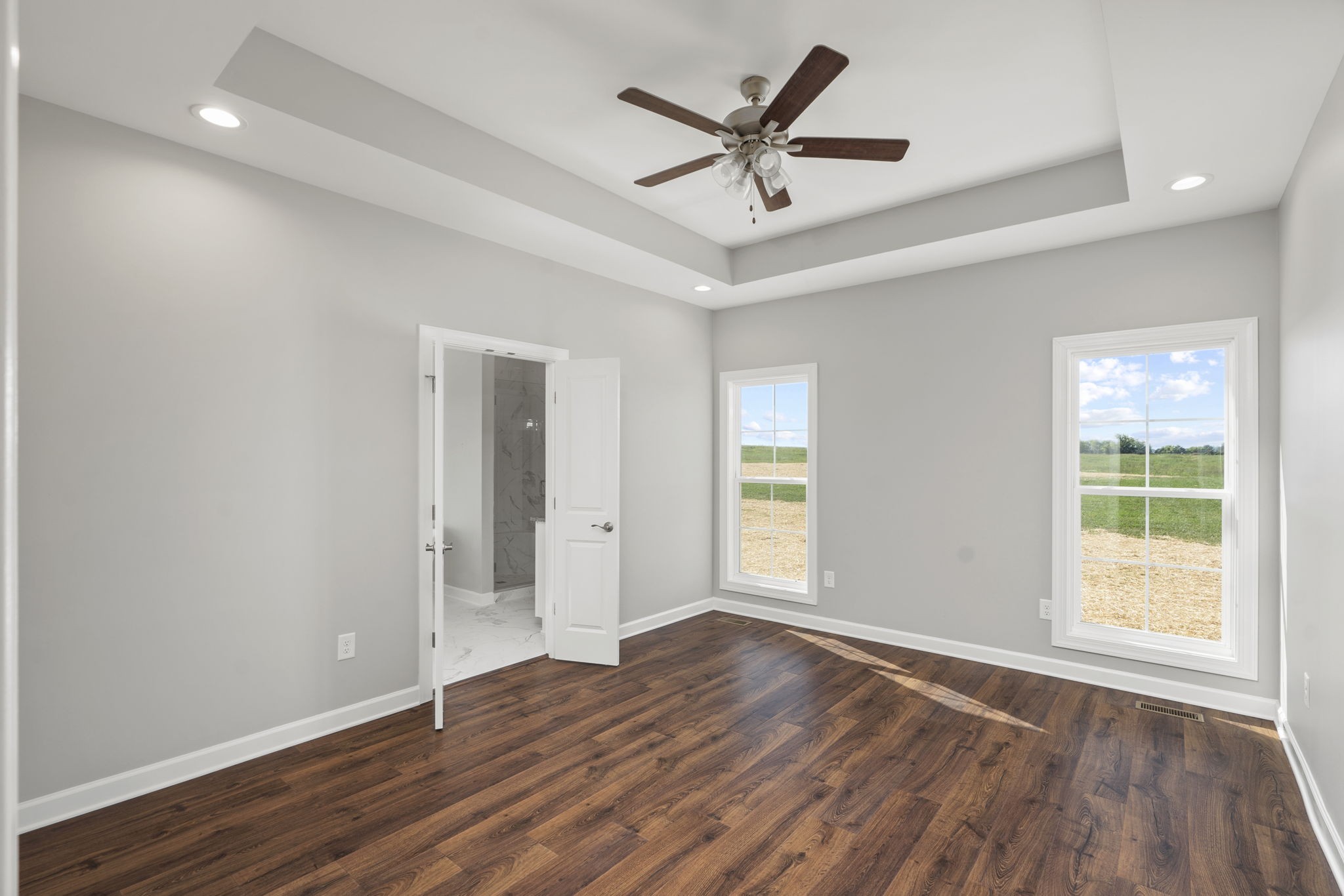 5557 Borthick Road Springfield, TN 37172 - Photo 23 of 48 an empty room with wooden floor and windows