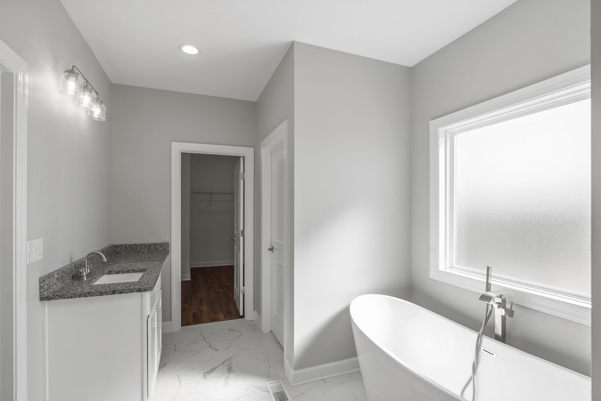 5557 Borthick Road Springfield, TN 37172 - Photo 28 of 48 a bathroom with a granite countertop sink and a mirror