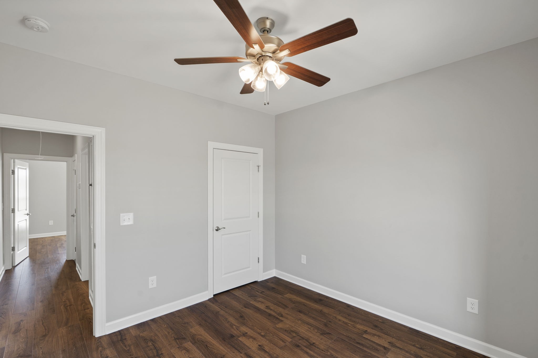 5557 Borthick Road Springfield, TN 37172 - Photo 33 of 48 an empty room with wooden floor and ceiling fan