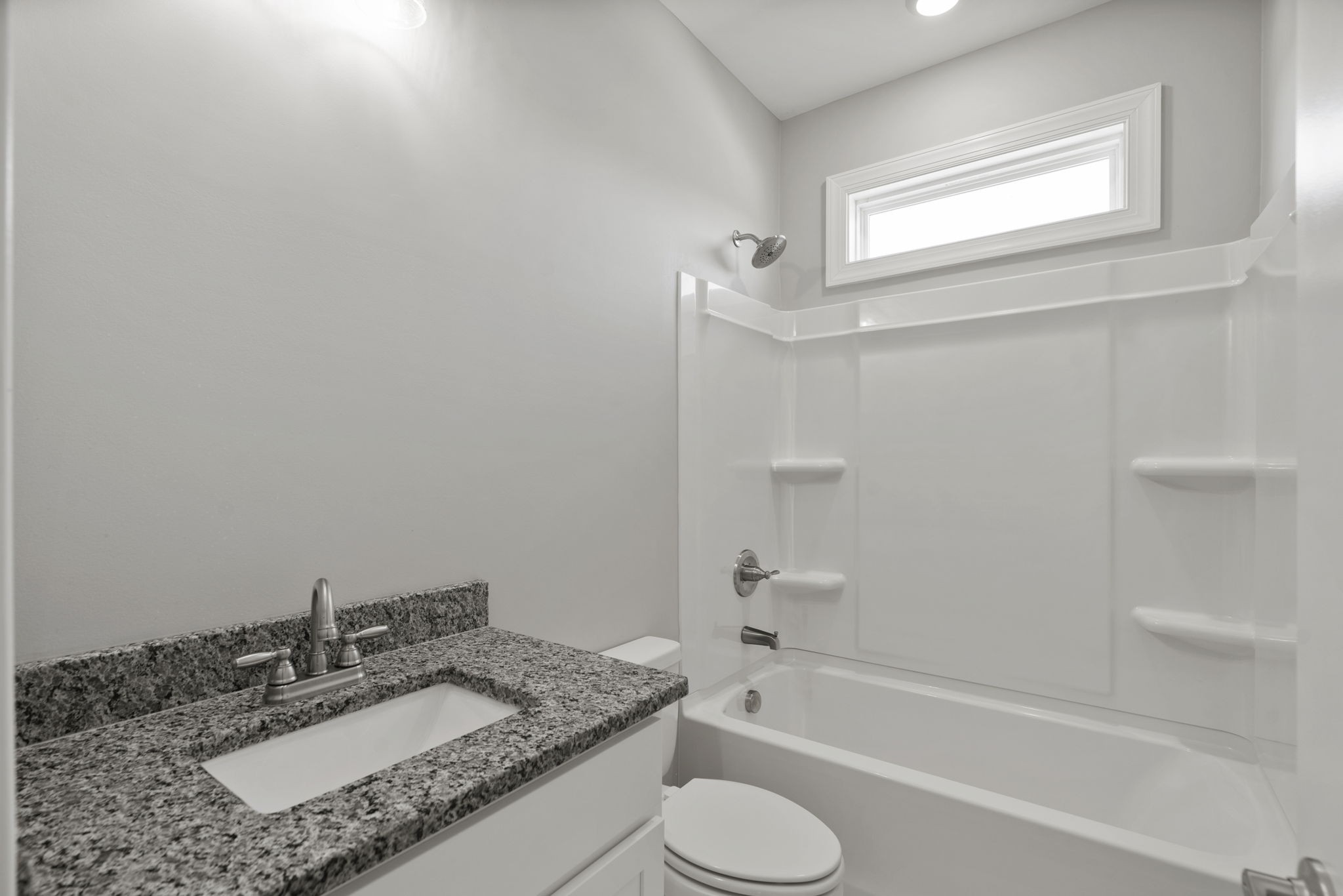 5557 Borthick Road Springfield, TN 37172 - Photo 34 of 48 a bathroom with a granite countertop sink toilet and shower