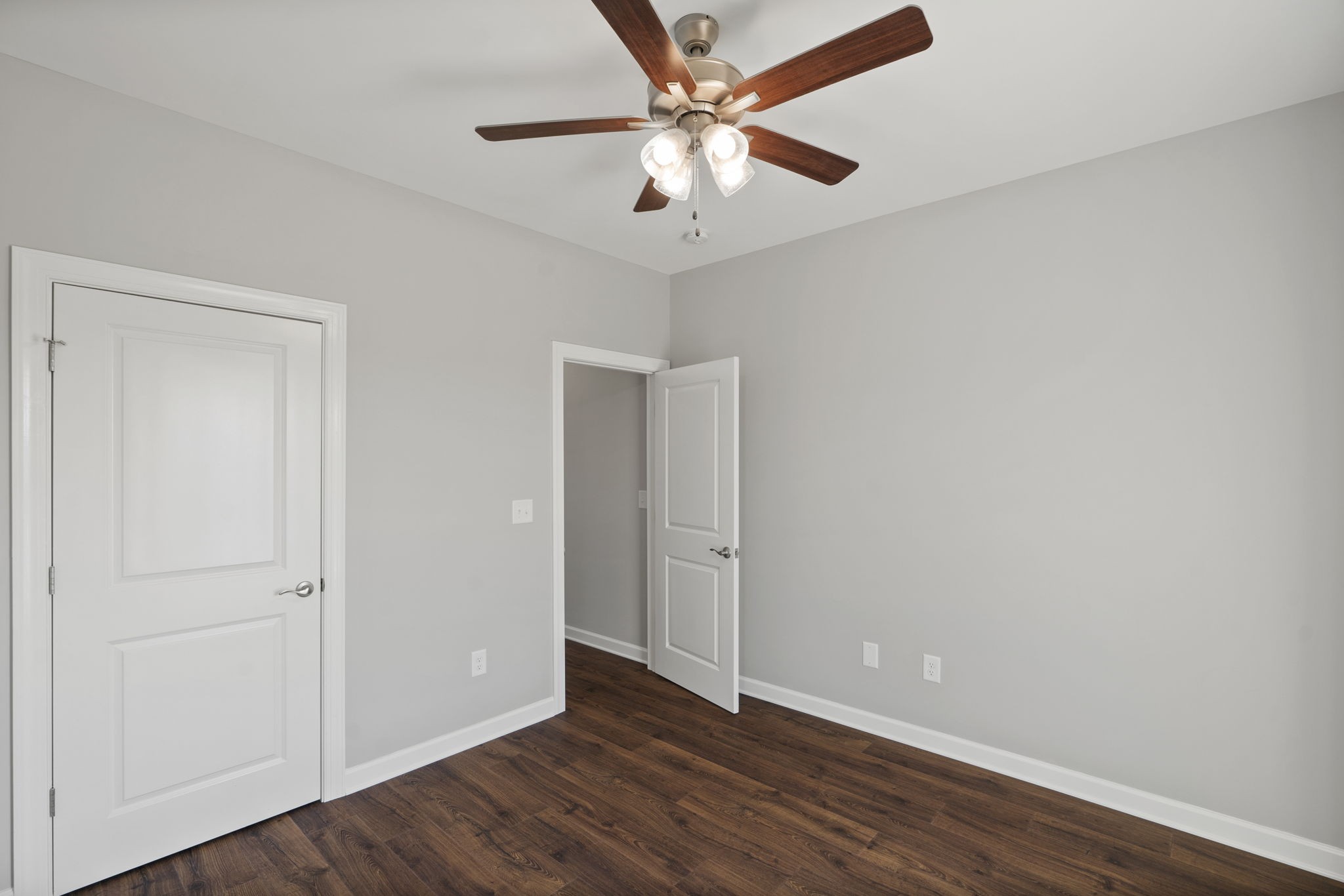 5557 Borthick Road Springfield, TN 37172 - Photo 36 of 48 an empty room with wooden floor and ceiling fan