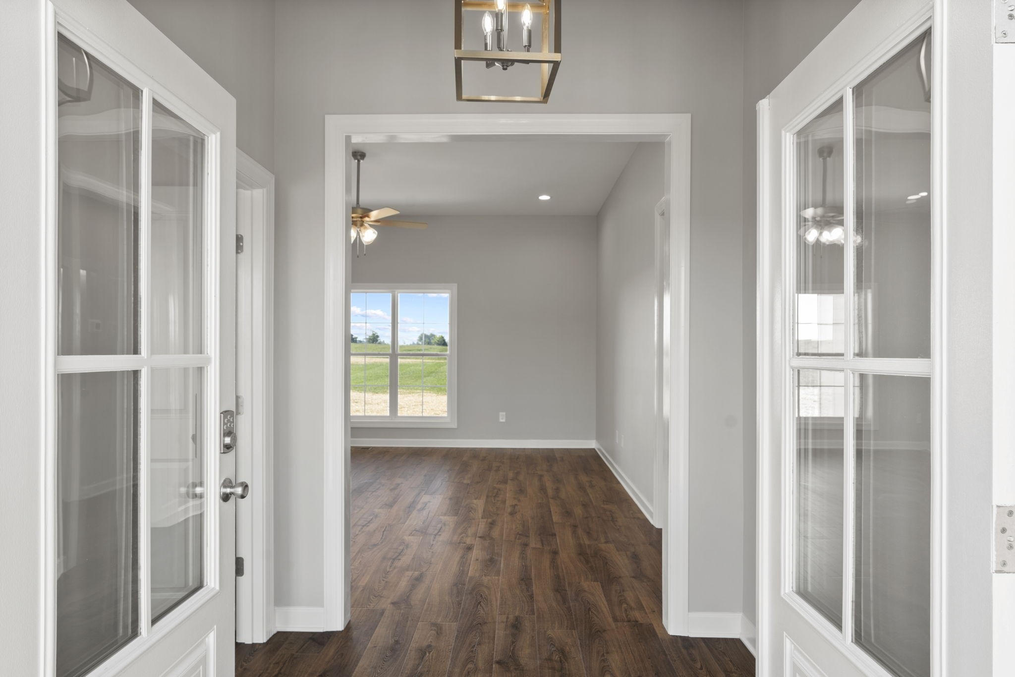 5557 Borthick Road Springfield, TN 37172 - Photo 9 of 48 a view of a hallway with wooden floor and staircase