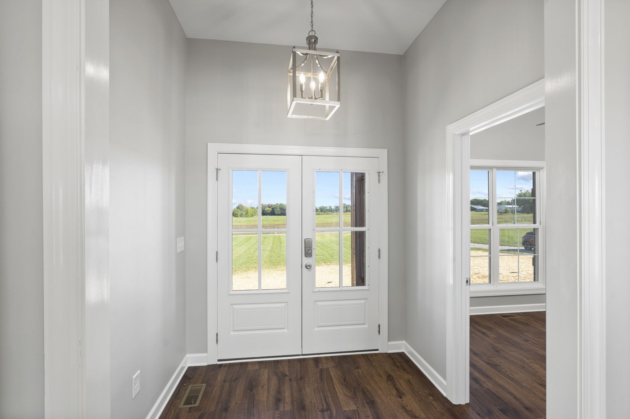 5557 Borthick Road Springfield, TN 37172 - Photo 10 of 48 an empty room with wooden floor and windows