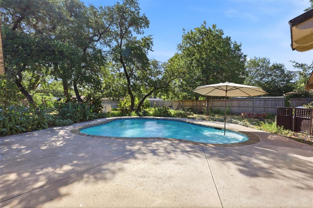 103 Paint Brush Road Lakeside, TX 76108 - Photo 2 of 24 a view of a swimming pool with a patio