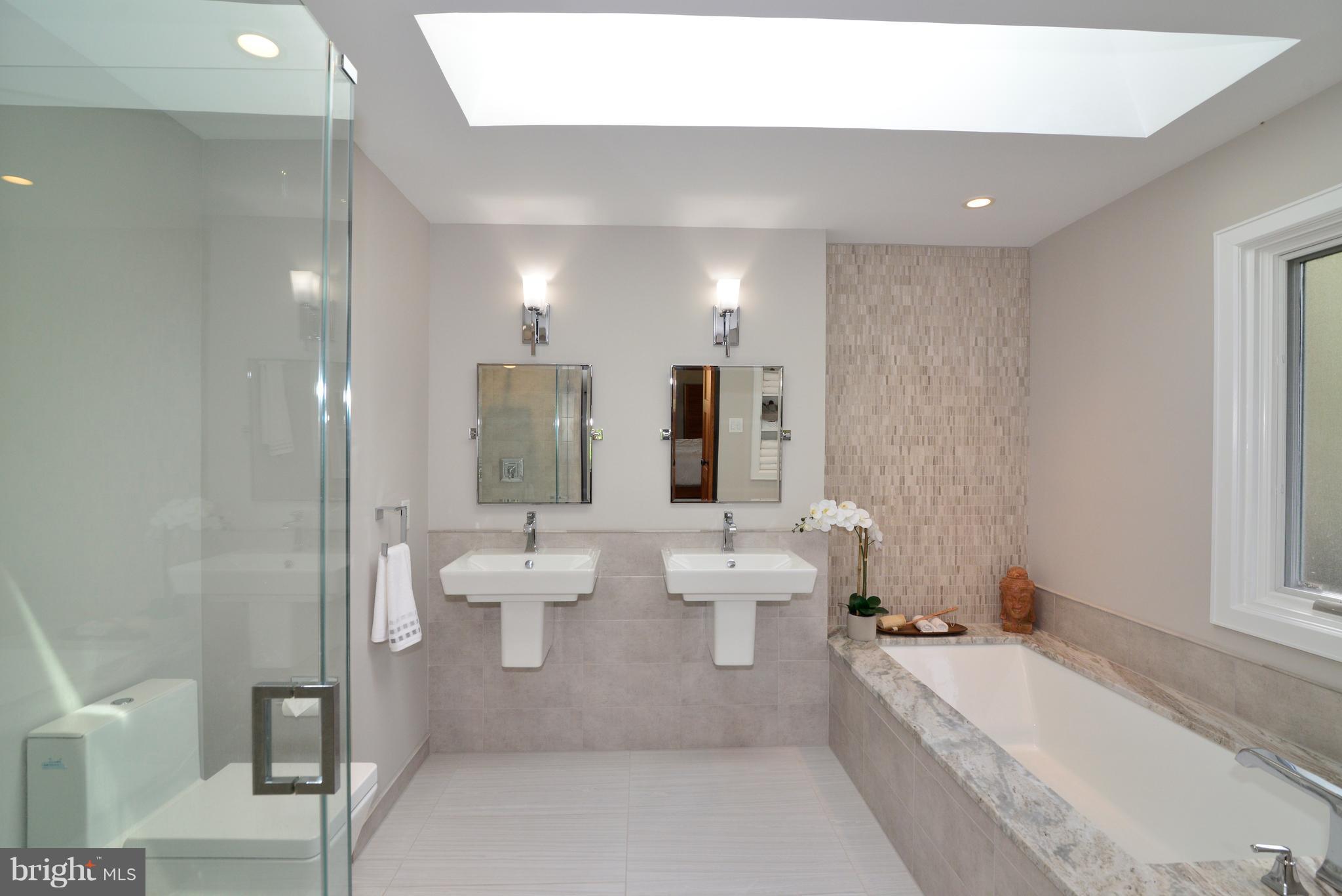 11316 South Shore Road Reston, VA 20190 - Photo 15 of 29 a large bathroom with a large tub and shower