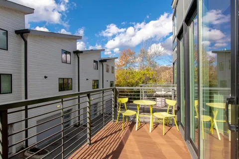 a view of a balcony with chairs