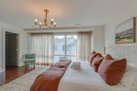 a bedroom with bed and a window