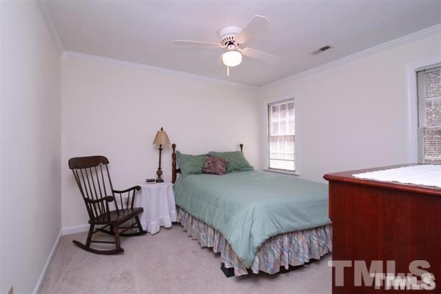 805 Thatcher Way Raleigh, NC 27615 - Photo 15 of 25 a bedroom with a bed chair and window