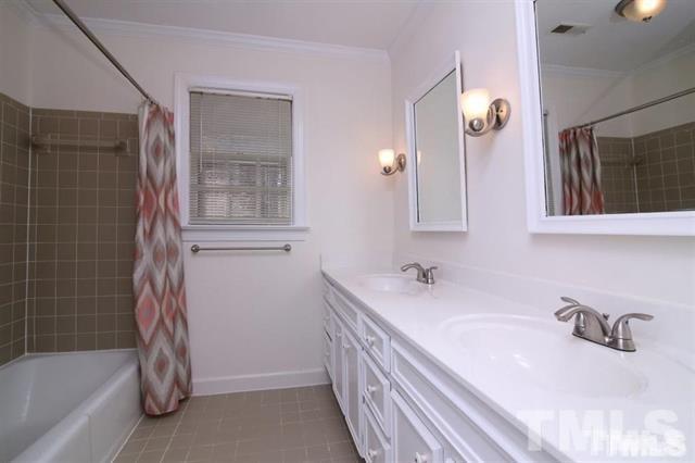 805 Thatcher Way Raleigh, NC 27615 - Photo 17 of 25 a bathroom with a bathtub sink and mirror