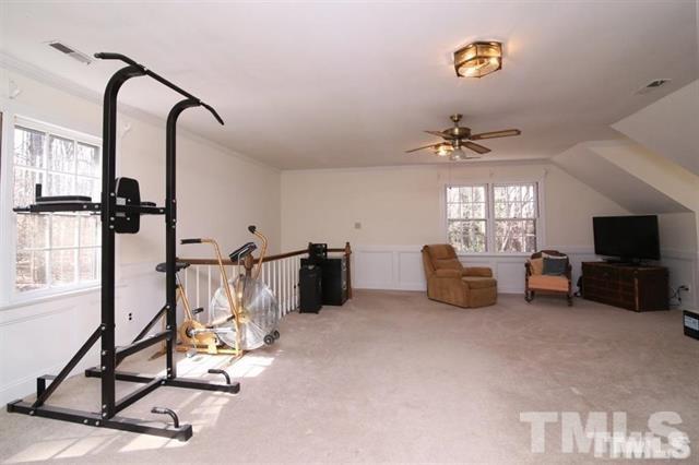 805 Thatcher Way Raleigh, NC 27615 - Photo 18 of 25 a view of a livingroom with furniture and a flat screen tv