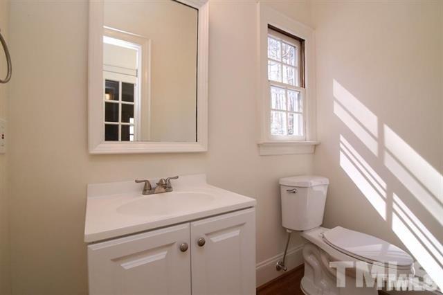 805 Thatcher Way Raleigh, NC 27615 - Photo 20 of 25 a bathroom with a sink toilet and a window