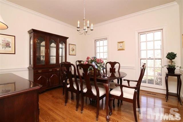 805 Thatcher Way Raleigh, NC 27615 - Photo 5 of 25 a view of a dining room with furniture window and wooden floor